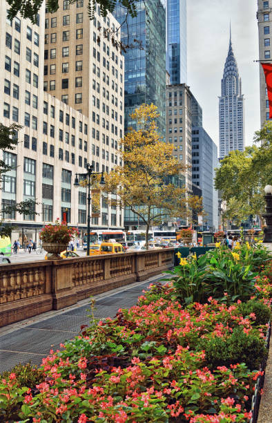 42nd Street with Chrysler Building. Streets of Manhattan. 42nd Street with Chrysler Building - view from the Bryant Park. 42nd street stock pictures, royalty-free photos & images