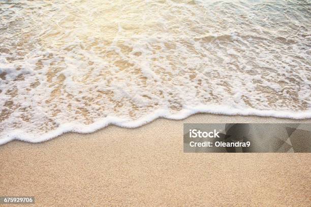 Soft Wave Of Sea On The Sandy Beach Stock Photo - Download Image Now - Beach, Heat - Temperature, Sunset