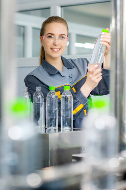 istock Worker at a water factory 675930416