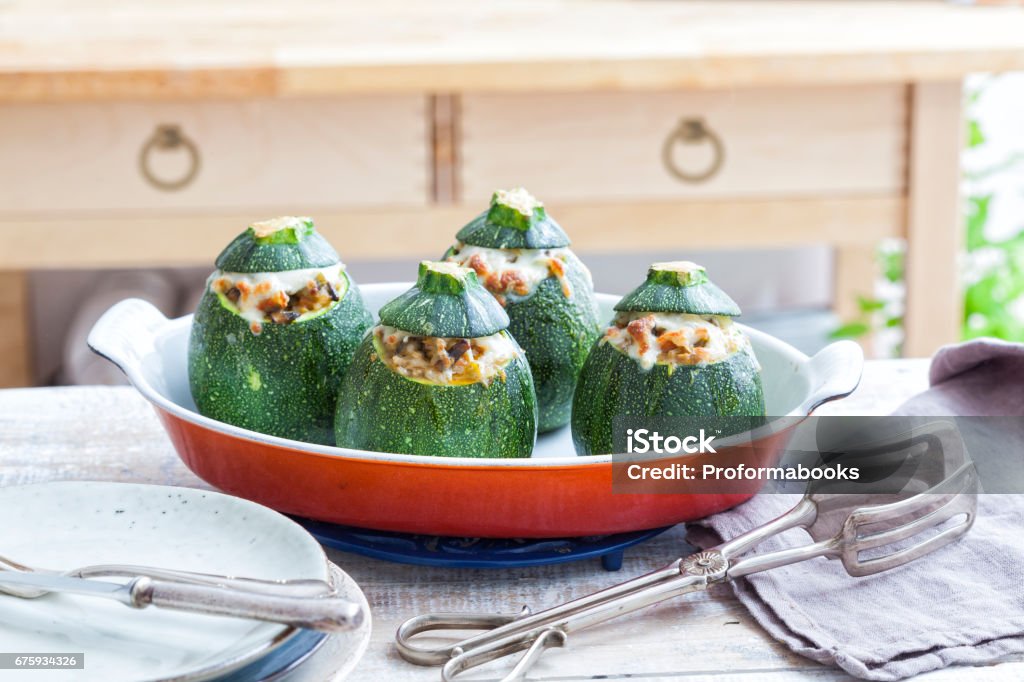 Oven baked round zucchini Stuffed oven baked round zucchini on an oven dish. Zucchini Stock Photo