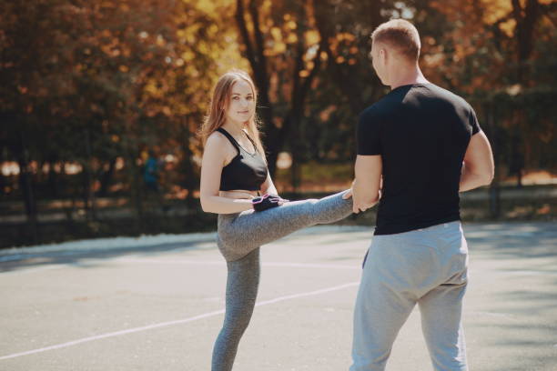 istock man and woman in park 675938268