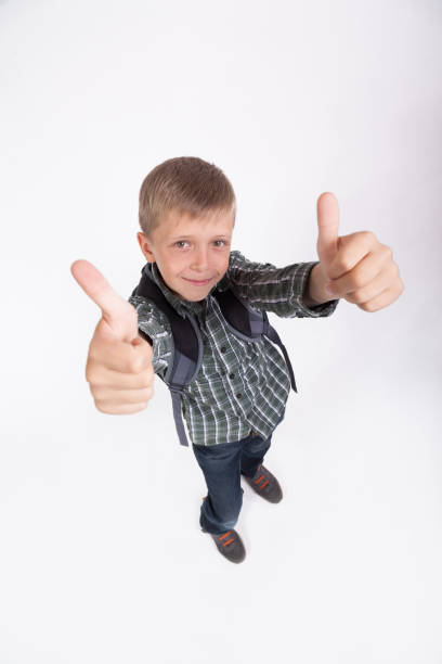 istock beautiful student with a backpack on his shoulders standing on white background and smiling 675944716