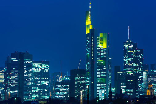 Frankfurt skyline illuminated at dusk, financial district, Germany, long exposure with tripod.