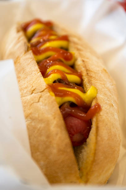 istock Grilled Hot Dog on wood background 675947628