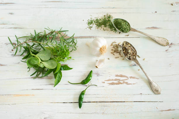 istock Spices and herbs on wooden background 675952906