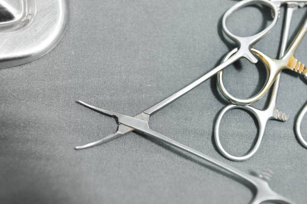 istock Detail shot of steralized surgery instruments with a hand grabbing a tool 675968324