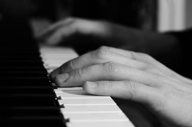 istock Male hands playing the piano 675971790