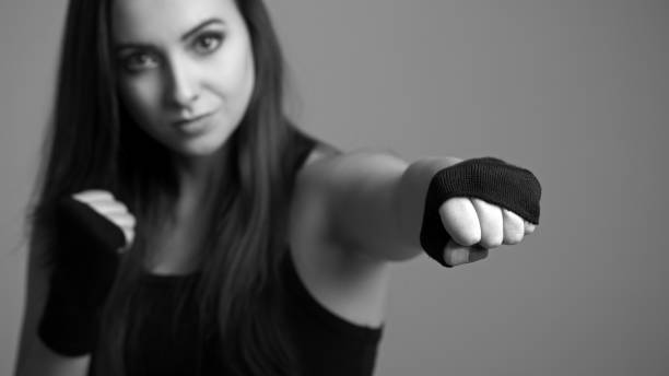 Young boxing woman. Small depth of field stock photo