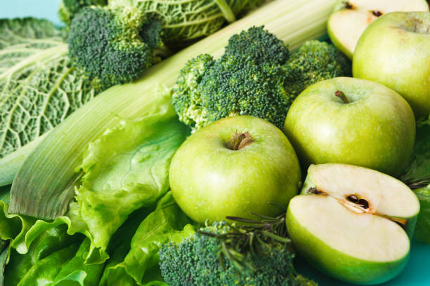 istock Flat lay of green vegetables on bright background 675975504