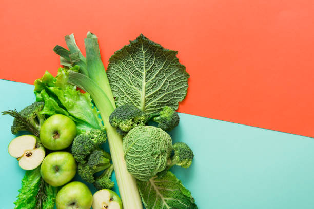 istock Flat lay of green vegetables on bright background 675975806