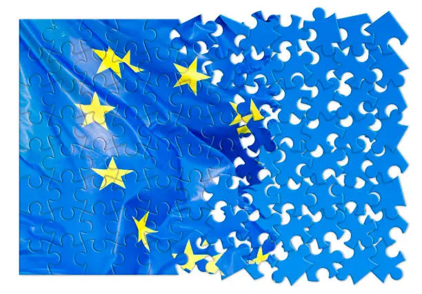 Photo of Frayed European flag - concept image in jigsaw puzzle shape