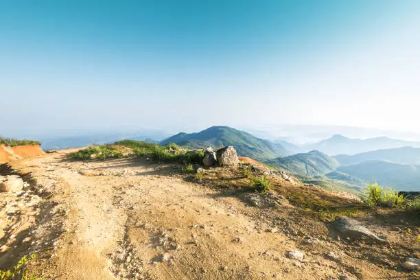 Photo of rock stone road in sunrise with tire imprint for automobile commercial