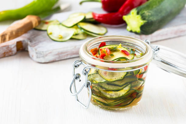 istock Marinated zucchini salad in glass jar 675985354