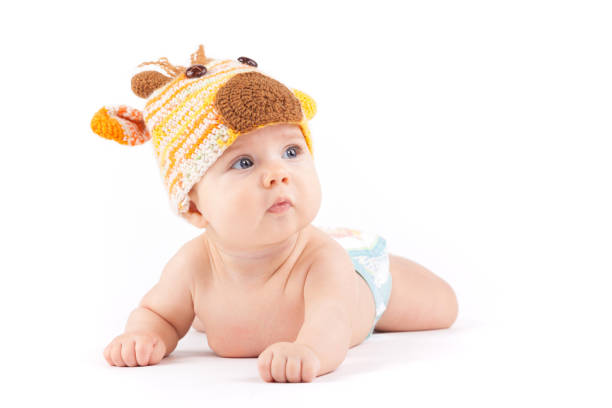 istock cutie little boy in white diaper and deer hat 675990190