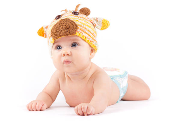 istock cutie little boy in white diaper and deer hat 675990208