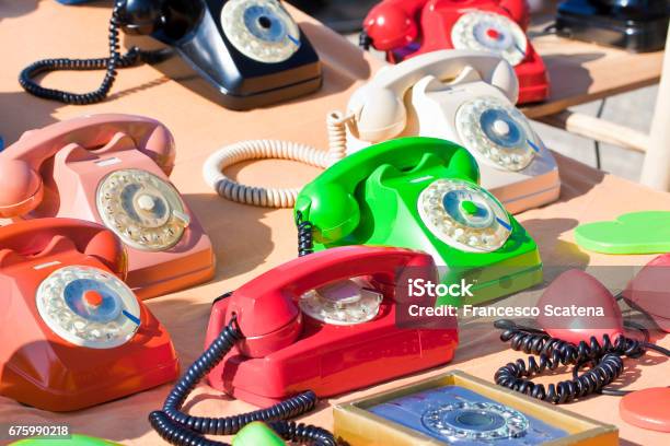 Old Colored Plastic Analog Phone In A Flea Market Stock Photo - Download Image Now - Flea Market, Analog, Analogue Audio Storage Media