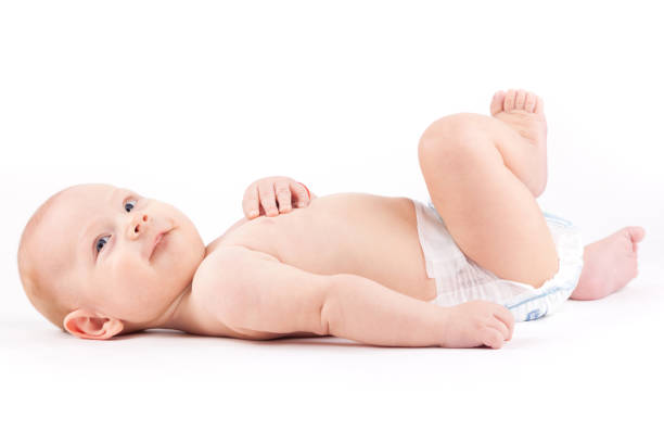istock happy cute little boy in white diaper 675993914
