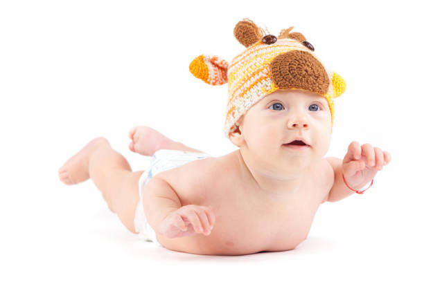 istock cutie little boy in white diaper and deer hat 675993942