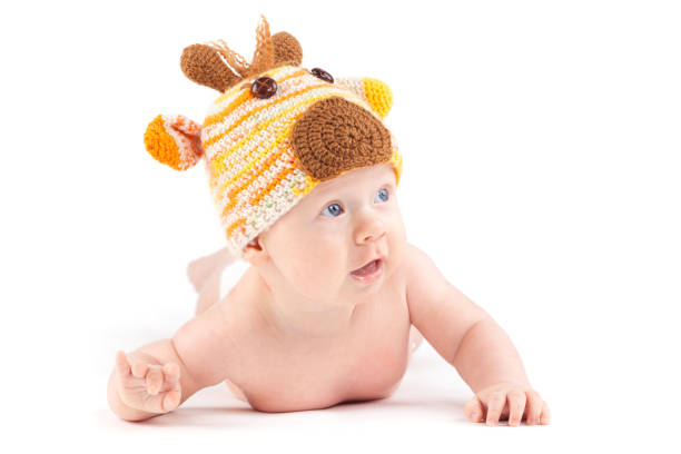 istock cutie little boy in white diaper and deer hat 675993978