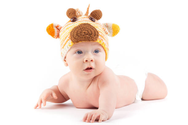 istock cutie little boy in white diaper and deer hat 675993988