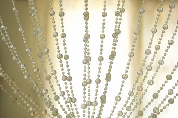 Magical curtains pearls decoration and backlit background