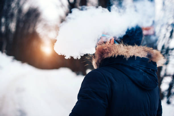 istock Man with beard smoke electronic cigarette outdoor 676000096