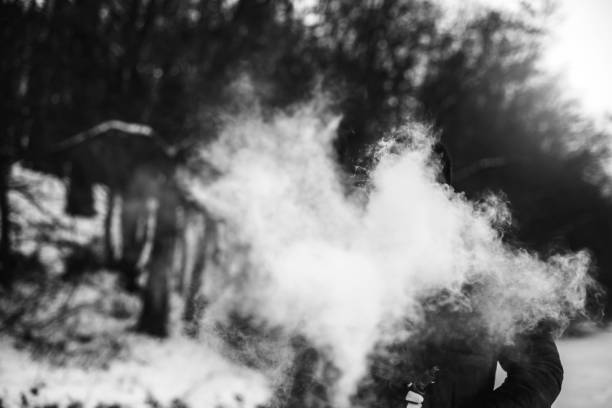 istock Man with beard smoke electronic cigarette outdoor 676000320