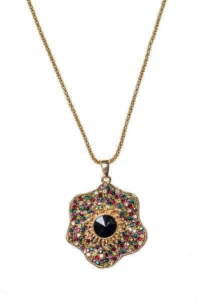 istock gold pendant with a black gems on a white background 676003874
