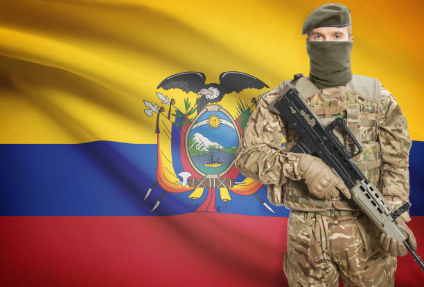 istock Soldier holding machine gun with flag on background series - Ecuador 676007566