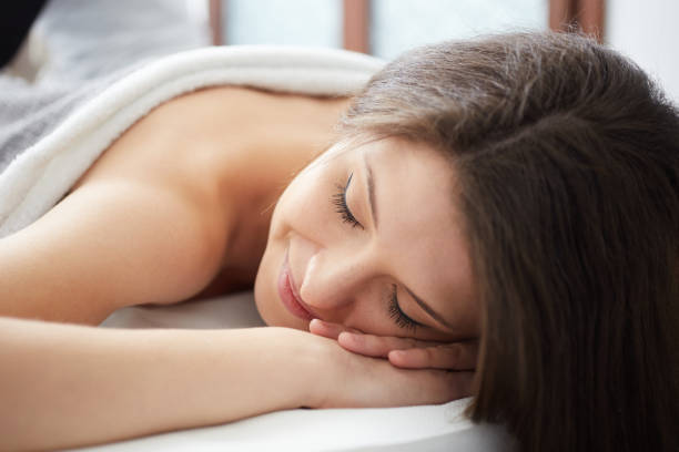 istock Beautiful woman having relaxing massage  in spa salon 676008638