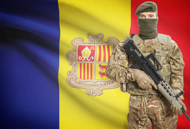 istock Soldier holding machine gun with flag on background series - Andorra 676008868