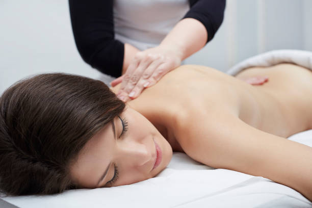 istock Beautiful woman having relaxing massage  in spa salon 676009070