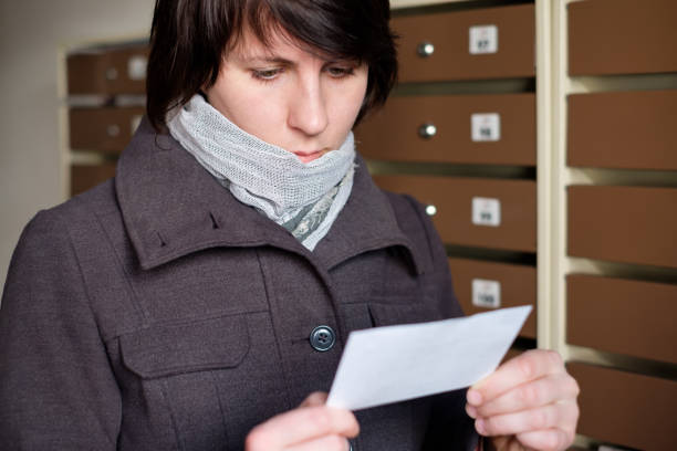 Portrait Of A Shocked Young Woman Reading Letter