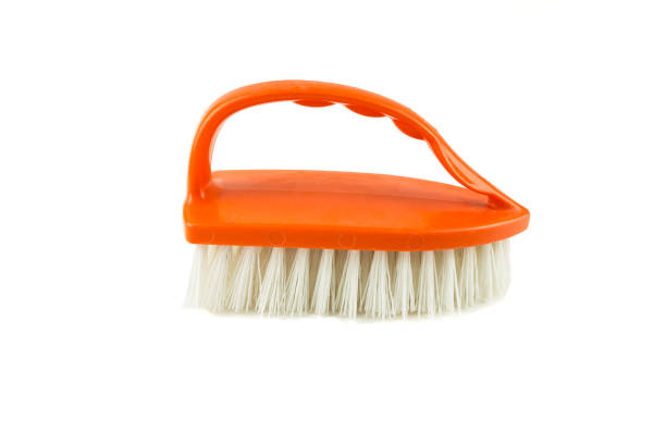 istock Orange Cleaning brush isolated 676011776