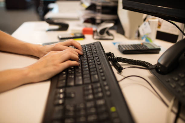 istock Cropped hands of businesswoman using computer keyboard at office 676018770