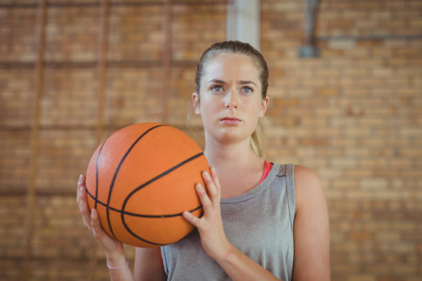 istock Determined girl holding a basket ball 676019886