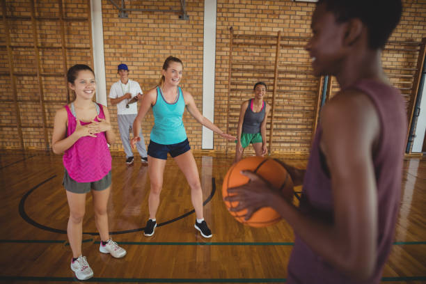 istock Determined girl holding a basket ball 676022452