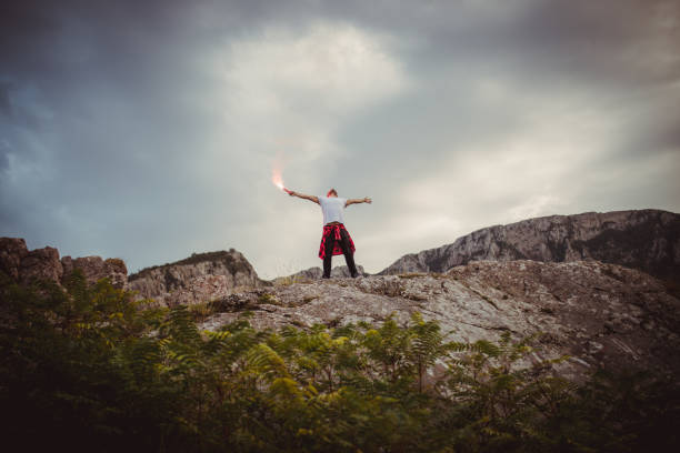 istock Young hipster in the mountains 676023892