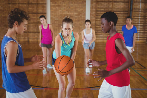 istock High school kids about to start playing basketball 676024704