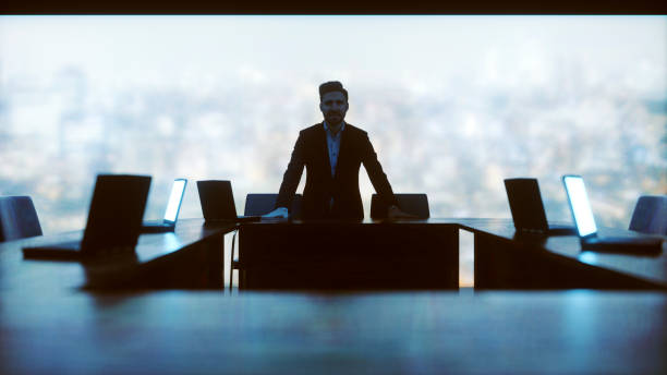 istock Businessman standing in front of desk 676027698