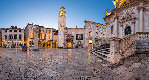 DUBROVNIK, CROATIA - JULY 1, 2014: Panorama of Luza Square and Sponza Palace in Dubrovnik. In 1979, the city of Dubrovnik joined the UNESCO list of World Heritage Sites.