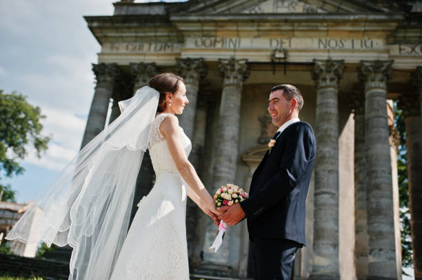 istock Wedding couple background old church with high columns . 676030282