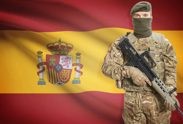 istock Soldier holding machine gun with flag on background series - Spain 676034176