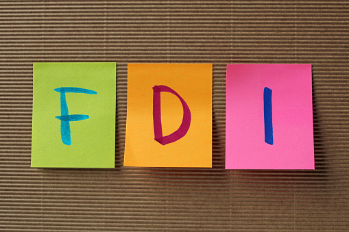FDI (Foreign Direct Investment) acronym on colorful sticky notes
