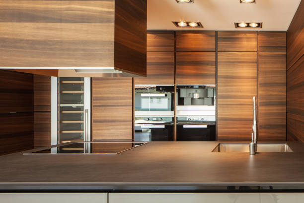 istock Wide brown kitchen in modern apartment 676053768