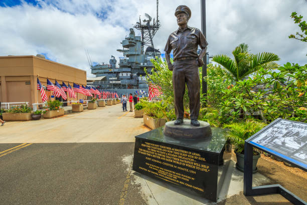 Admiral Chester W Nimitz HONOLULU, OAHU, HAWAII, USA - AUGUST 21, 2016: statue of Admiral Chester W. Nimitz at battleship Missouri Pearl Harbor Memorial with American flags. Commander in chief of United States Pacific Fleet. pearl harbor stock pictures, royalty-free photos & images