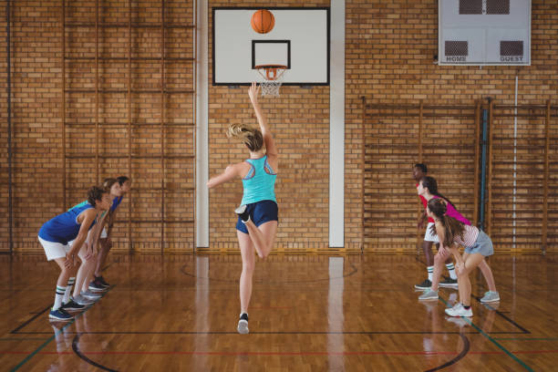 istock Determined high school kids playing basketball 676066550