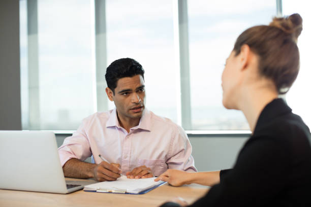 istock Business people discussing contract during meeting 676067622