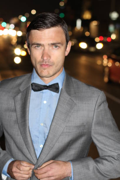 istock Man walking the city streets at night 676068390
