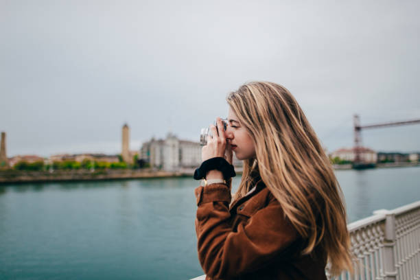 istock Young woman taking a picture 676109452